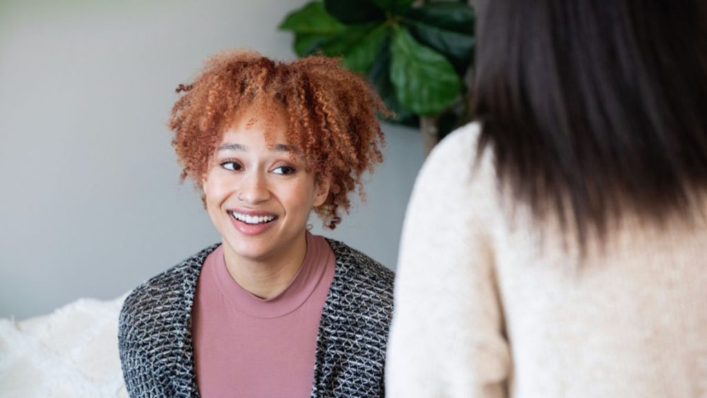 Client receiving mind-body-spirit wellness guidance from a Chopra Life Coach.