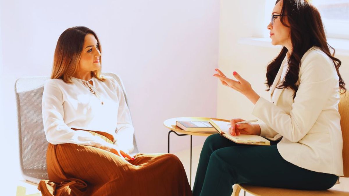 The life coach and client are discussing personal growth strategies.