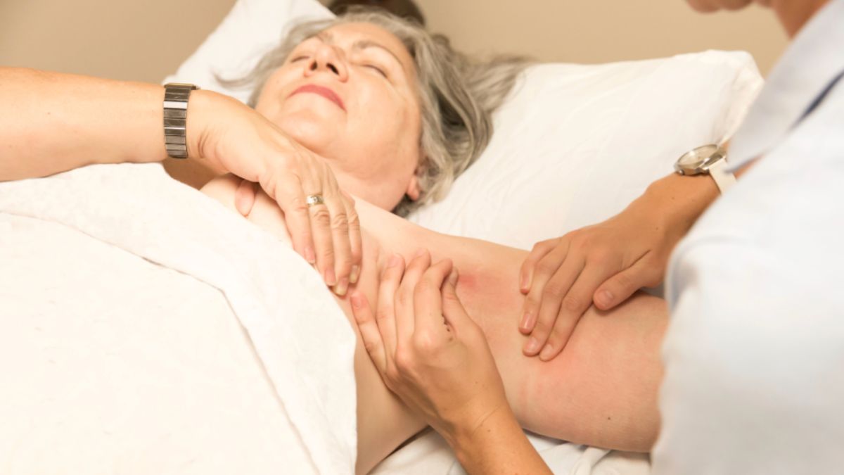 A woman receives a massage, emphasizing lymphedema therapy as part of oncology care.